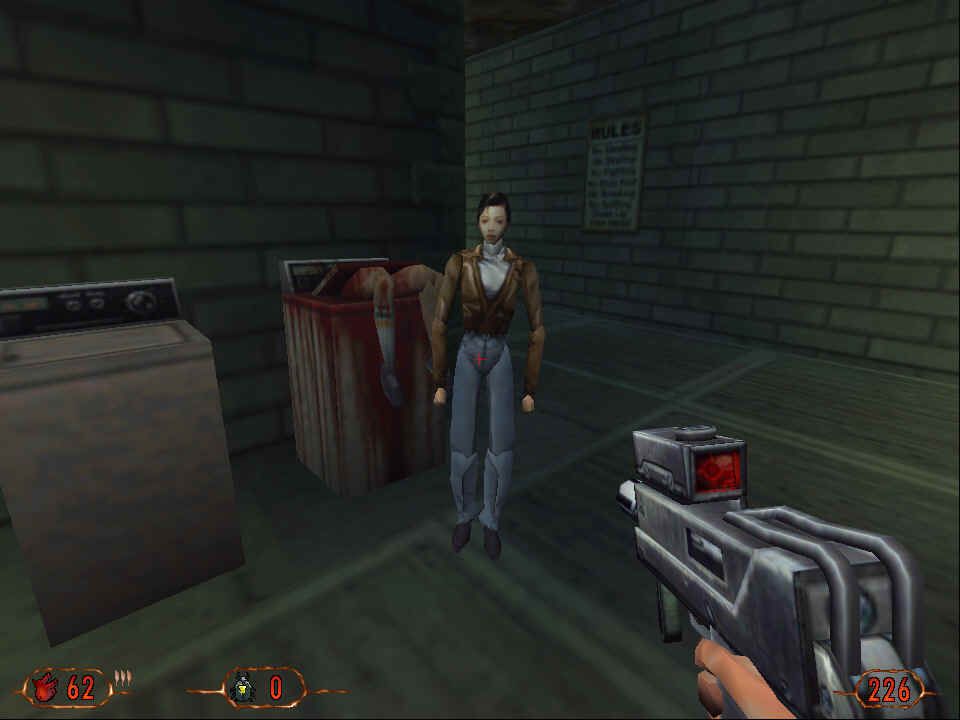 La famosa escena de la lavadora de Blood II: piernas sobresaliendo de un tambor ensangrentado mientras un personaje comenta la situación